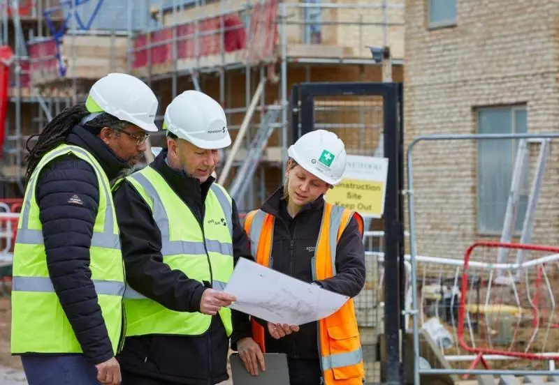 Northstone Construction team reviewing building plans on site